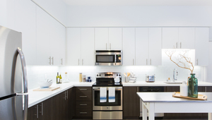 Modern kitchens with designer quartz countertops, stainless steel appliances and European-style wood cabinetry  